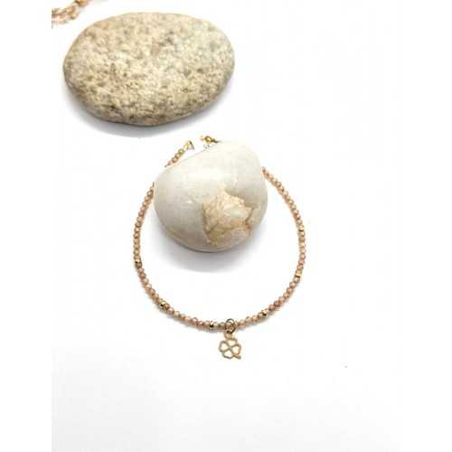 PULSERA DE ZIRCONITAS COLOR NUDE, TRÉBOL Y DONUTS ORO AMARILLO DE 18KT